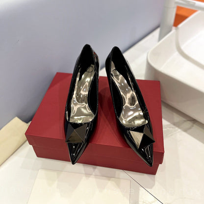 One Stud Black Patent Black Leather Pump